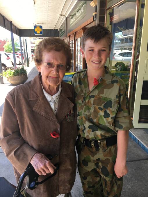 Veteran Eunice Clarke with Grenfell Cadet Hugh Wilson in Main Street during Remembrance Day. Photo B Wilson.