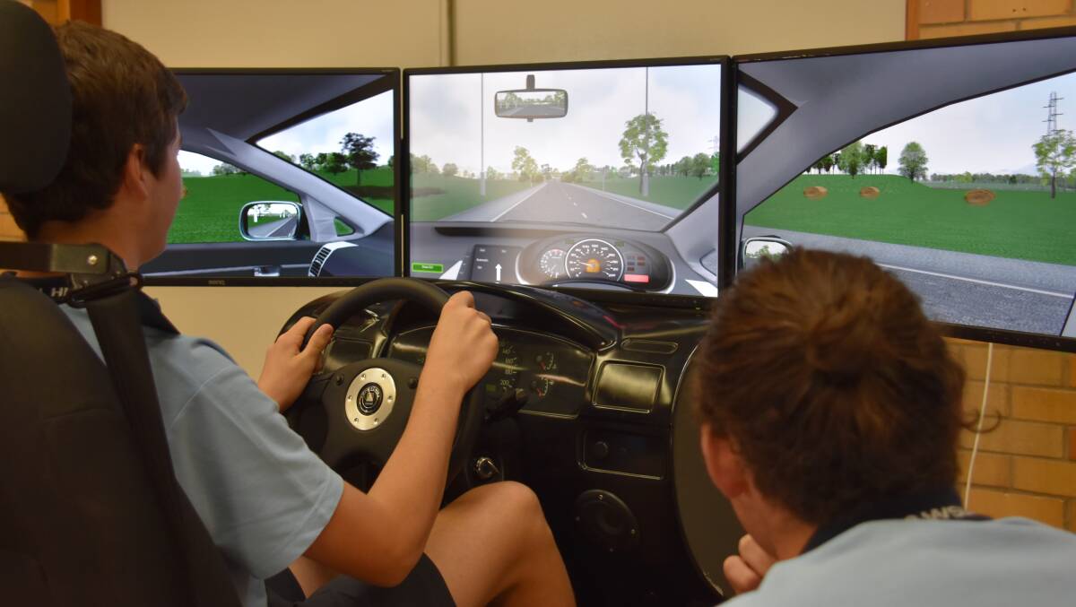 THLHS students Connor Day and Jesse Thompson-Jones testing out the Driver Training simulator. 