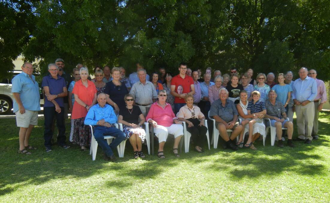 Nevin Hughes (CF) with his extended family and friends celebrating his 80th birthday. 