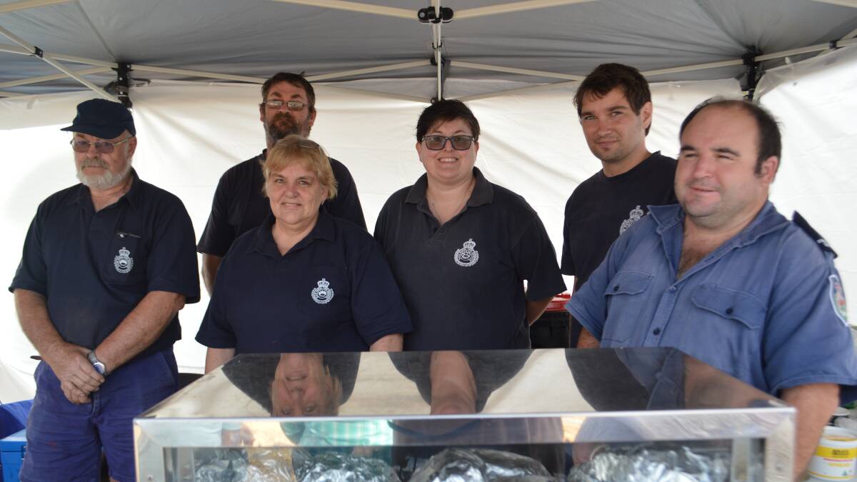 Members of the Grenfell Rural Fire Service providing the BBQ at the
Show Society's Team Penning event, Saturday on April 21. 
