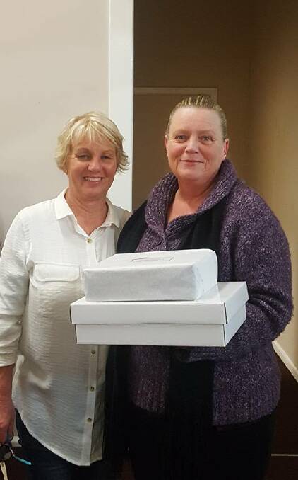 Winner of the GJRLC Quiz Night lucky door prize was Shelly Ryan pictured with sponsor Kath Holz of Grenfell Furniture. Picture GJRLC.
