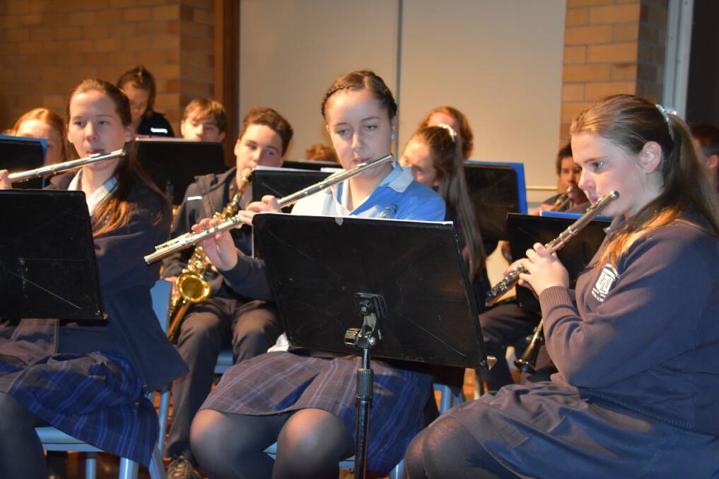 The School band performing at the assembly. 