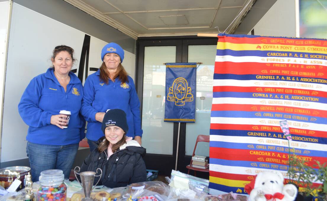Pony Club members Tracey Mackay, Di Leibick and Lily Vardy at the street stall.