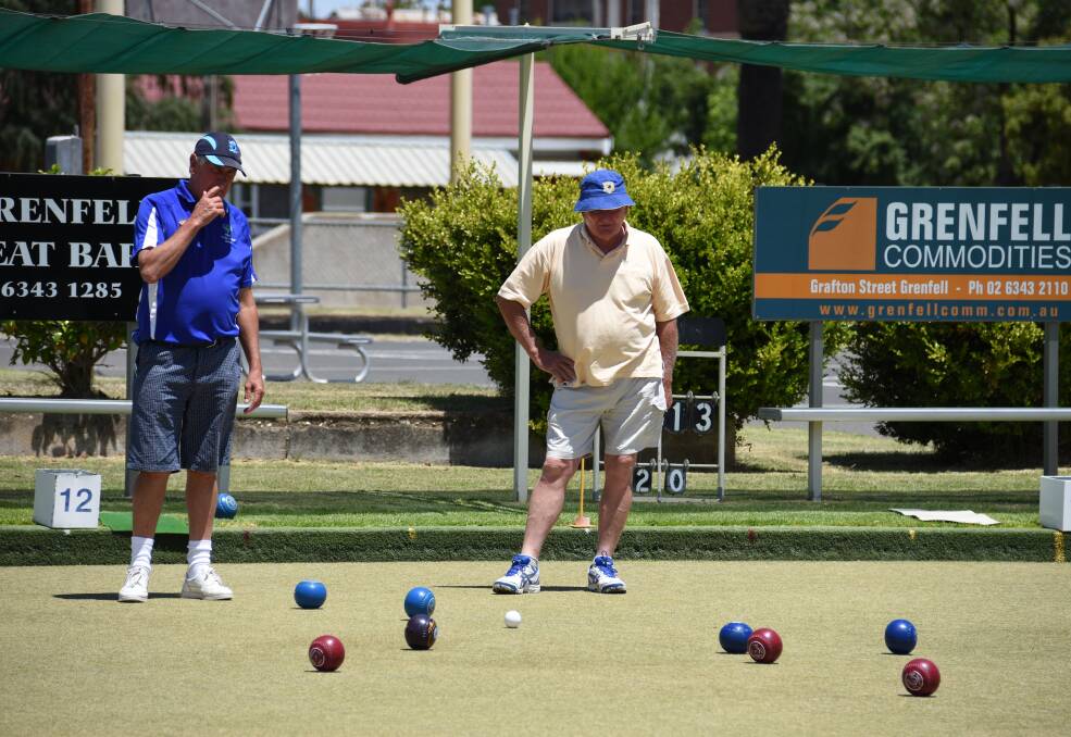 LAWN BOWLS: Grenfell bowlers contemplate their next move in a recent event at Grenfell Bowling club.