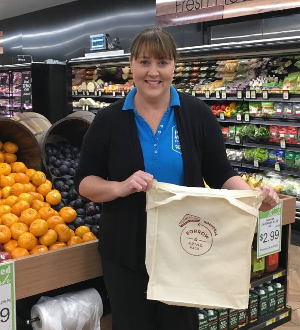 Mawhood's IGA store manager Kellie Johnstone with the Boomerang Bags. Photo H Carpenter.