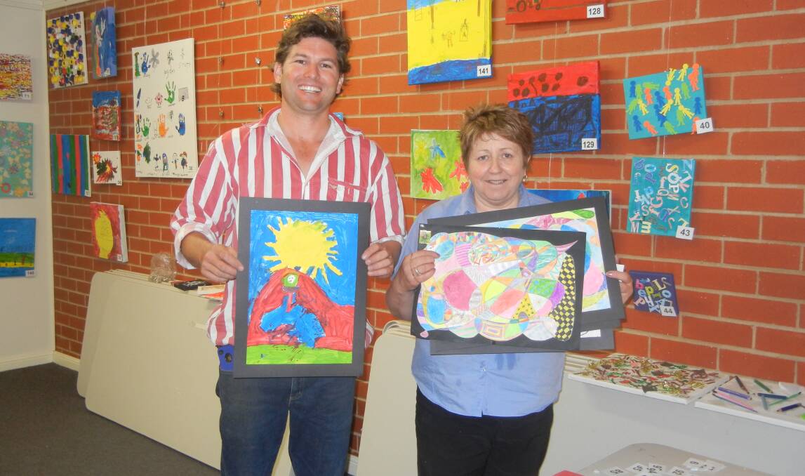 Tim Wood and Sharon Grant hanging the Pre-School "Little Picasso Exhibition" November 5, 2011.