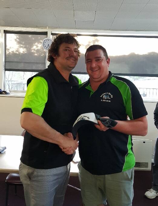 Nearest to pin was Daniel Fanning (L) receiving his prize from Doug Kohnan. Image supplied 
