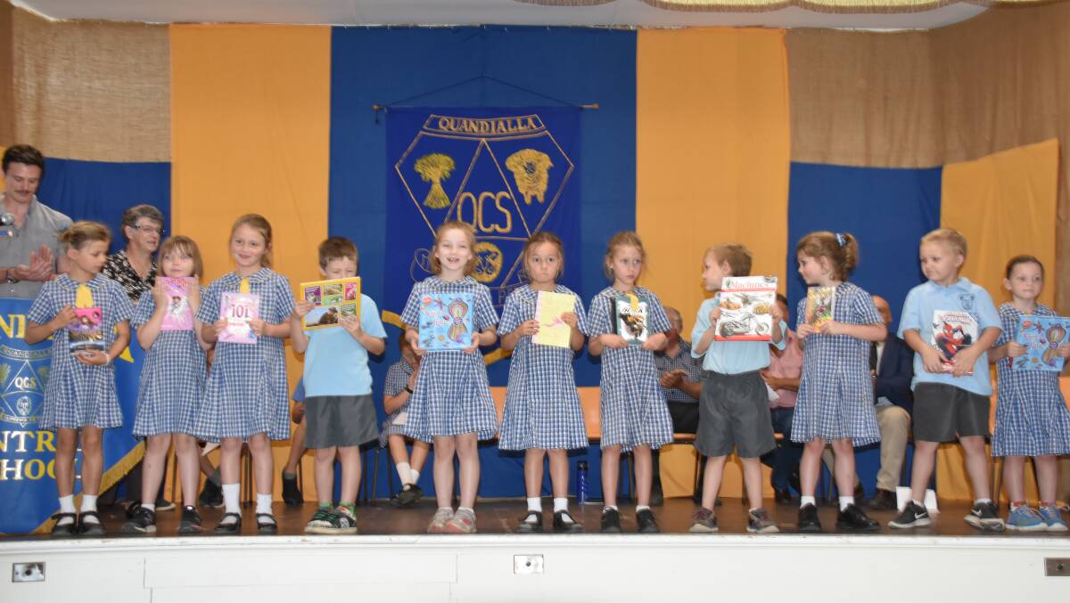 Students receiving their book awards. 
