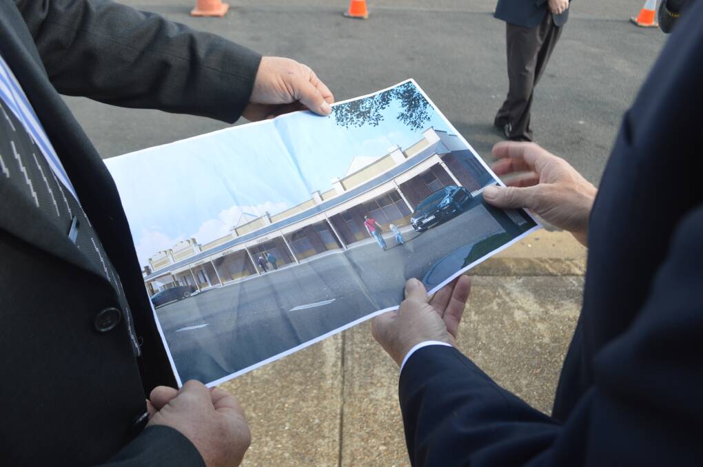 Member for Riverina Michael McCormack and Weddin Shire Mayor Mark Liebich take a look at an artists' impression of Grenfell's proposed new medical centre.