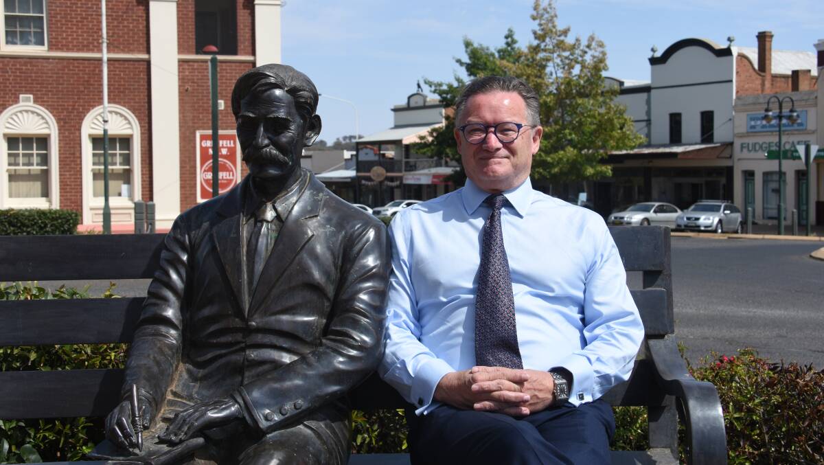 Mark Douglass, candidate for Country Labor, has his photo taken in Main Street with Henry.
