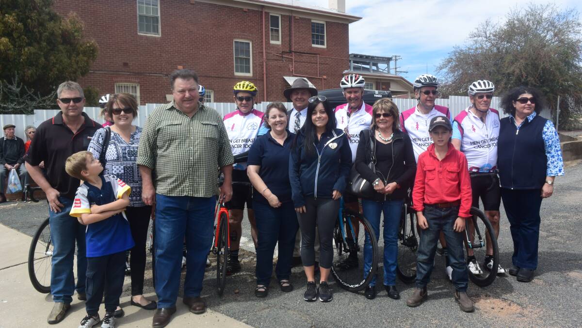 Wayne Heathcote and his cycling team with members of the Lynch family in Grenfell.