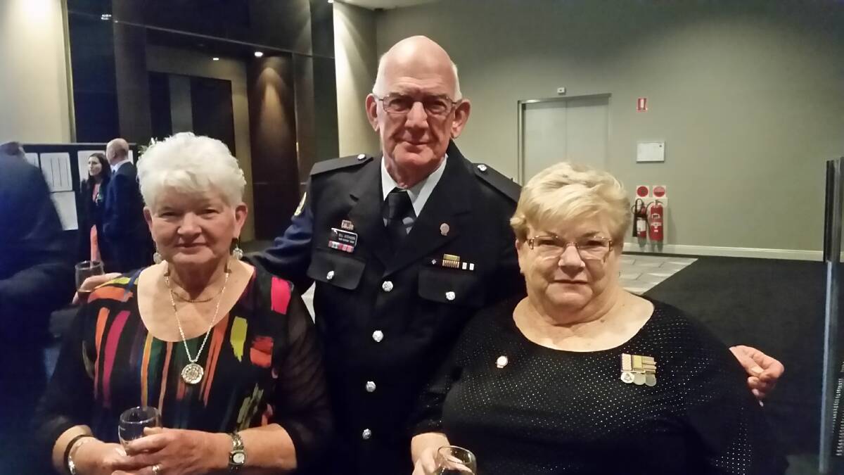 Jan and Bill Atchison with Bill fellow-SES volunteer and good friend, Robyn Huer.  A member of the Illawarra SES, Robyn first worked together with Bill in 2003 and they worked together at disasters such as the Toowoomba floods and Victorian bushfires. Contributed.