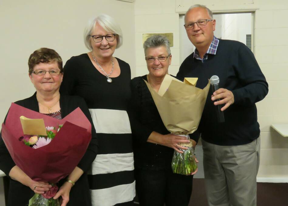Rhonda O'Brien (L) and Carole Baldwin (3rd L) were presented with flowers by the former school captains.