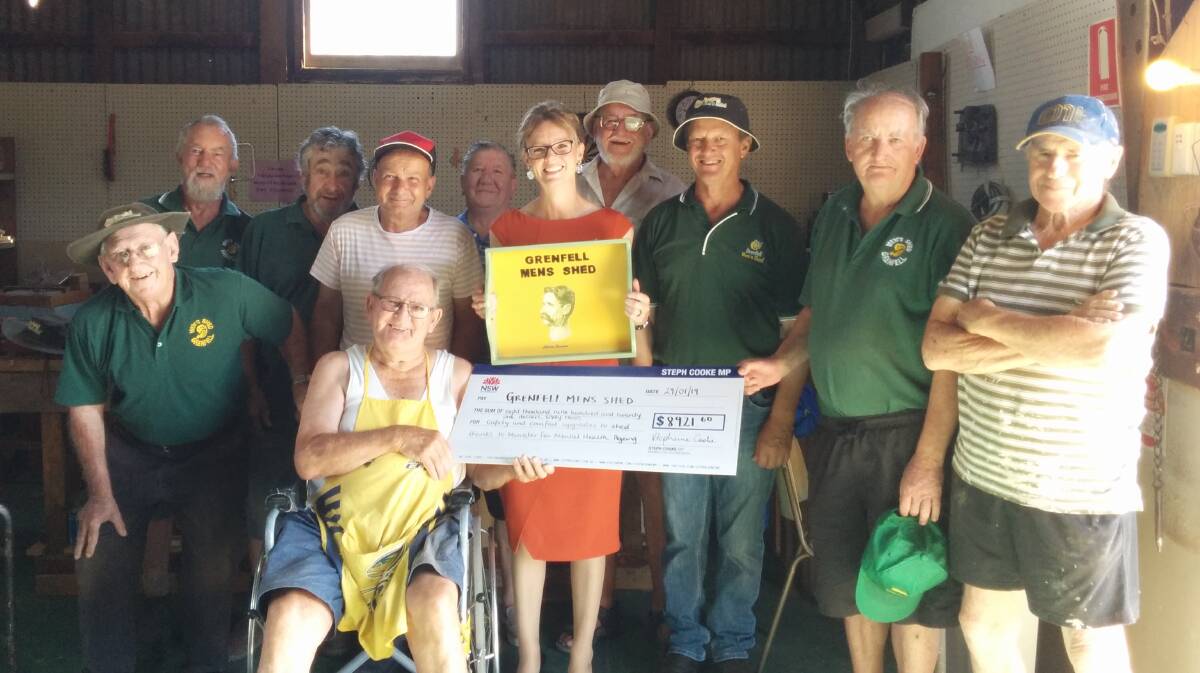 Grenfell Men's Shed members are thrilled to receive funding from the NSW Government presented by Member for Cootamundra Steph Cooke. Image supplied
