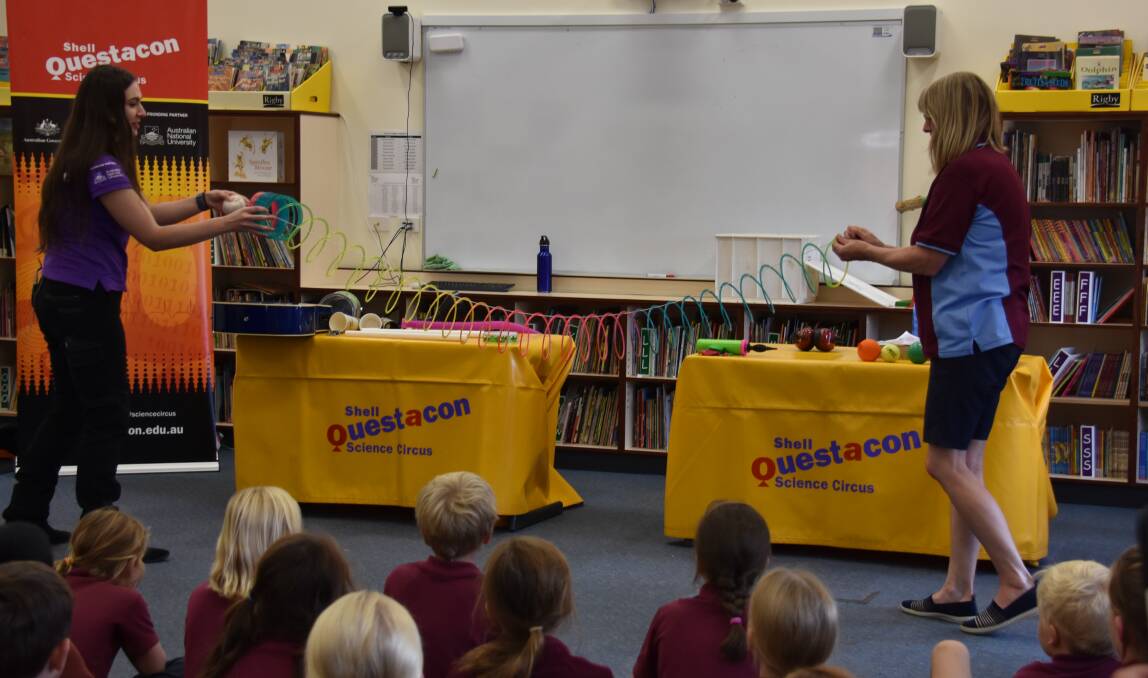 St Joseph's primary school teacher Mrs Heath (R) joined in on the action at the recent travelling Questacon Science Circus held at the school.  