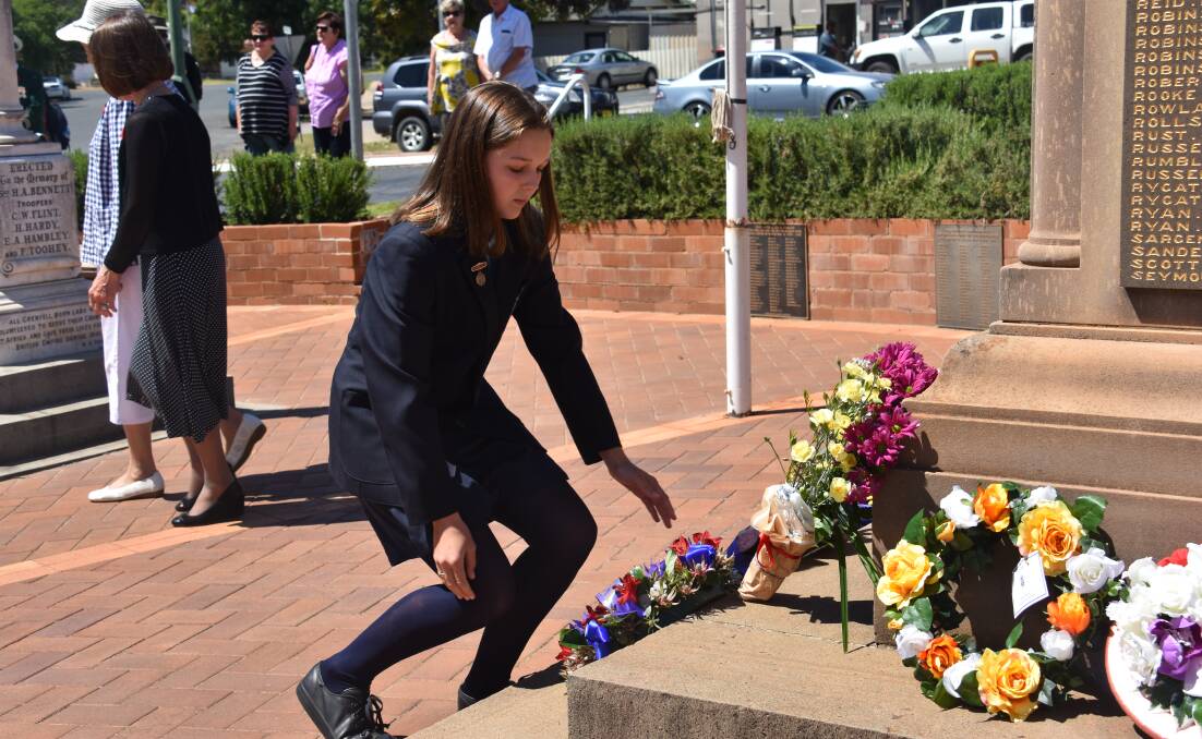 Annabella Taylor lays a wreath on behalf of Grenfell Public School. 