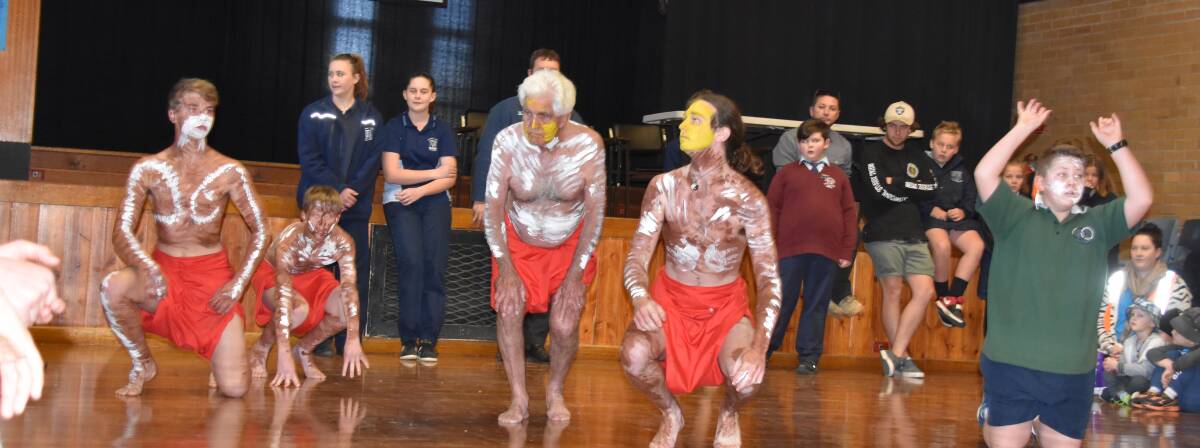 The THLHS Aboriginal Dance group performing in the school hall. 