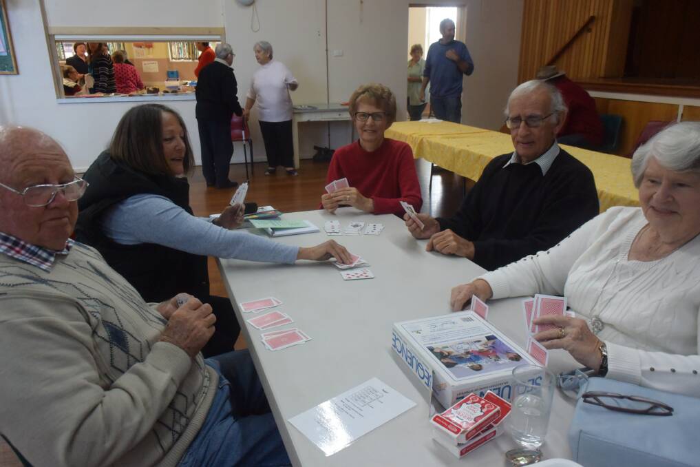 Having a game of 'Snitch' at the Leisure Group Biggest Morning Tea last Thursday are Margaret and Bob Basset, Cherie and Graham Pattrick and Desiree Bottilier.