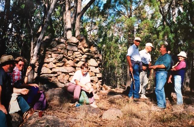 Weddin Wanderers pictured at the trig station situated at the summit of Yambira Mountain in 1999. Image supplied 