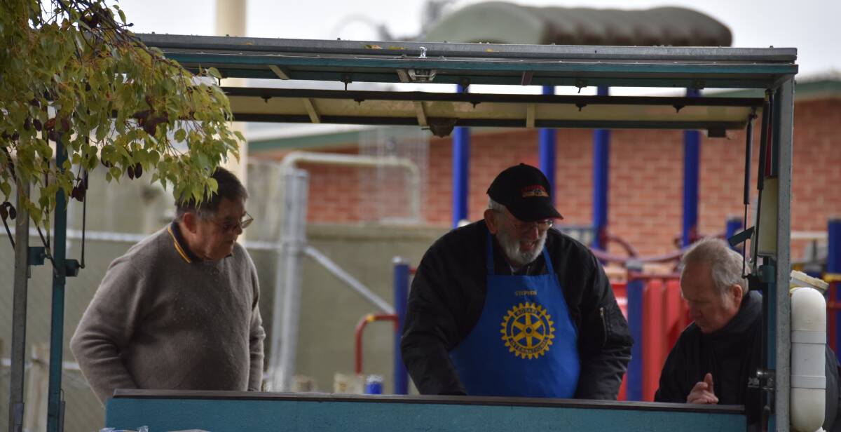 Busy cooking up a storm at the Grenfell Rotary Market Day are Rotarians Phillip Walmsley, Stephen Lander and Ross Craven.  