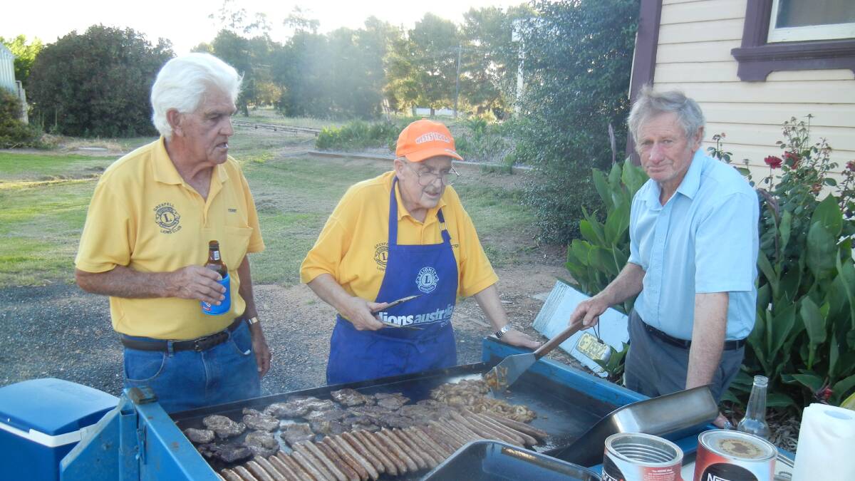 Terry Carroll, Peter Butcher and Brian Hughes at the RSL Christmas BBQ. 