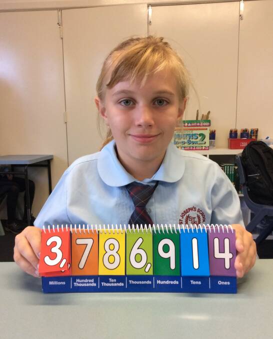 Alyssa Heathcote with just one of the large numbers that Yr. 3/4 have been working with in class. Photo St Joseph's Primary School.
