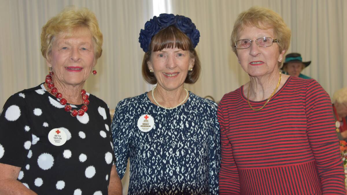 Red Cross Grenfell branch members Beth Taylor and Wendy Anderson with Jan Eastaway at the 2017 Melbourne Cup Day luncheon. 