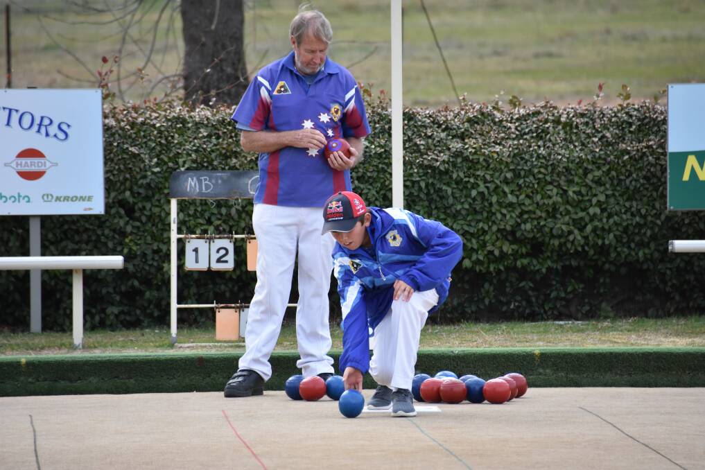 LAWN BOWLS: Legendary long-time Grenfell Bowlers say that youngster Rhys Hughes (pictured with Mark McSpadden) has incredible potential on the bowling greens.