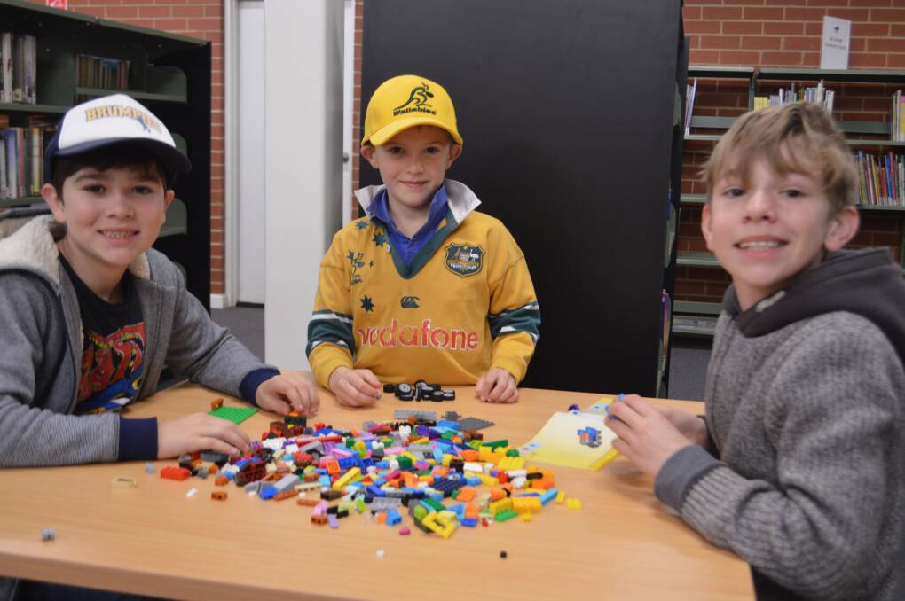 Fergus and Kirby Moore with Hamish Gibson during the library's recent games day.