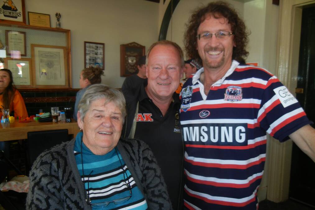 Gavin Johnson first prize winner in the Railway Hotel Footy Tipping Comp with Glenda and Graeme Sadler.  