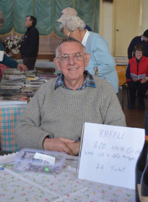 Barry Howell selling raffle tickets at the Anglican fete. 