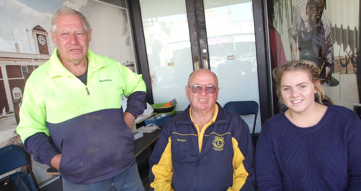 Ian Stokes, Barry Franklin and Lions HLF Queen entrant Tara Anderson during a recent Lion's Club Street Stall. 