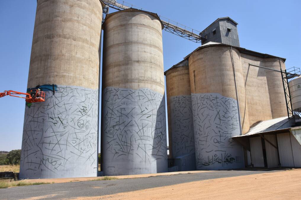 Painting has commenced on the Grenfell silos which will be transformed into a work of art.
