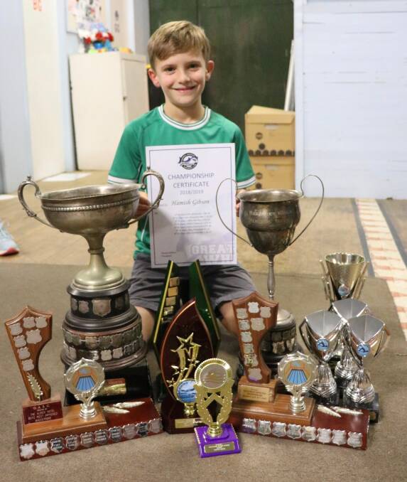 Hamish Gibson with all his awards from presentation night. Image supplied