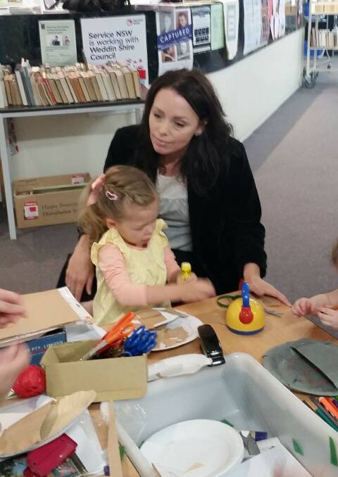 Children and parents creating with craft time.
