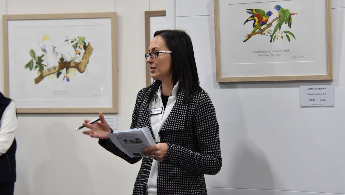 Weddin Shire Arts and Tourism officer Claire McCann introduces artists Lanny Mackenzie and Matt Georgevits at the exhibition opening on Tuesday July 24. 