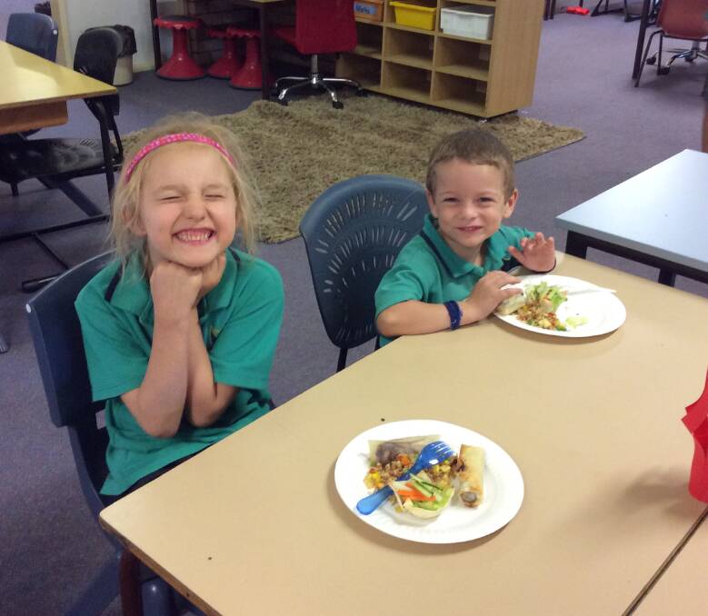 Students enjoy eating their Asian feast. Photo CPS