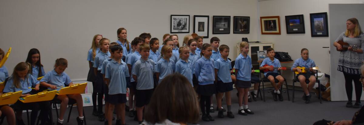 Students performed Christmas carols at the official opening of the exhibition.