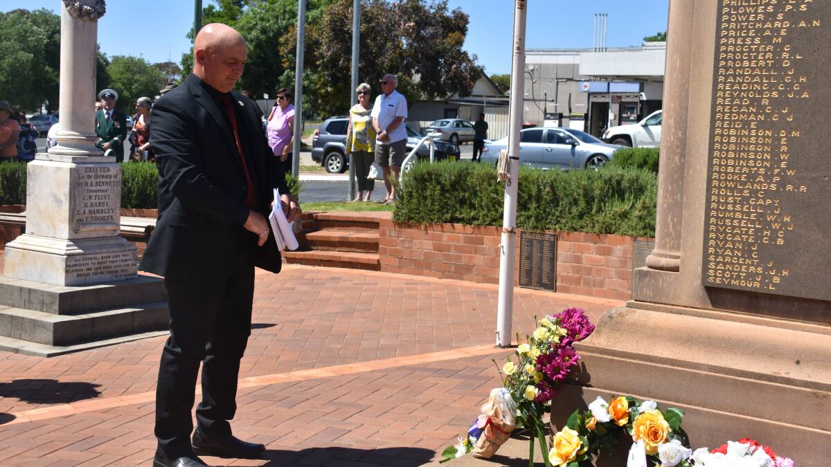 Weddin Shire mayor Mark Liebich lays a wreath on behalf of Council.