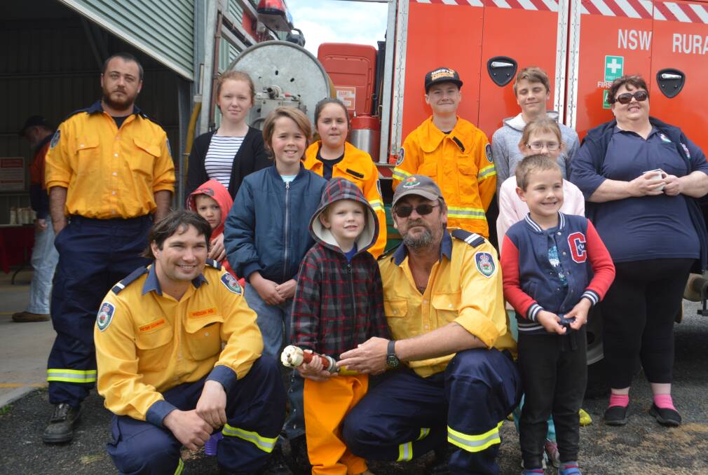 Weddin Headquarters NSW RFS volunteers along with family members and visitors at last Saturday's Open Day.