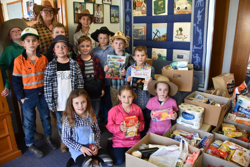 Grenfell Public School Principal Michelle Morley and students with their mammoth 'Doing it for our Farmers' donation ready to send off to the Grenfell collection point. 