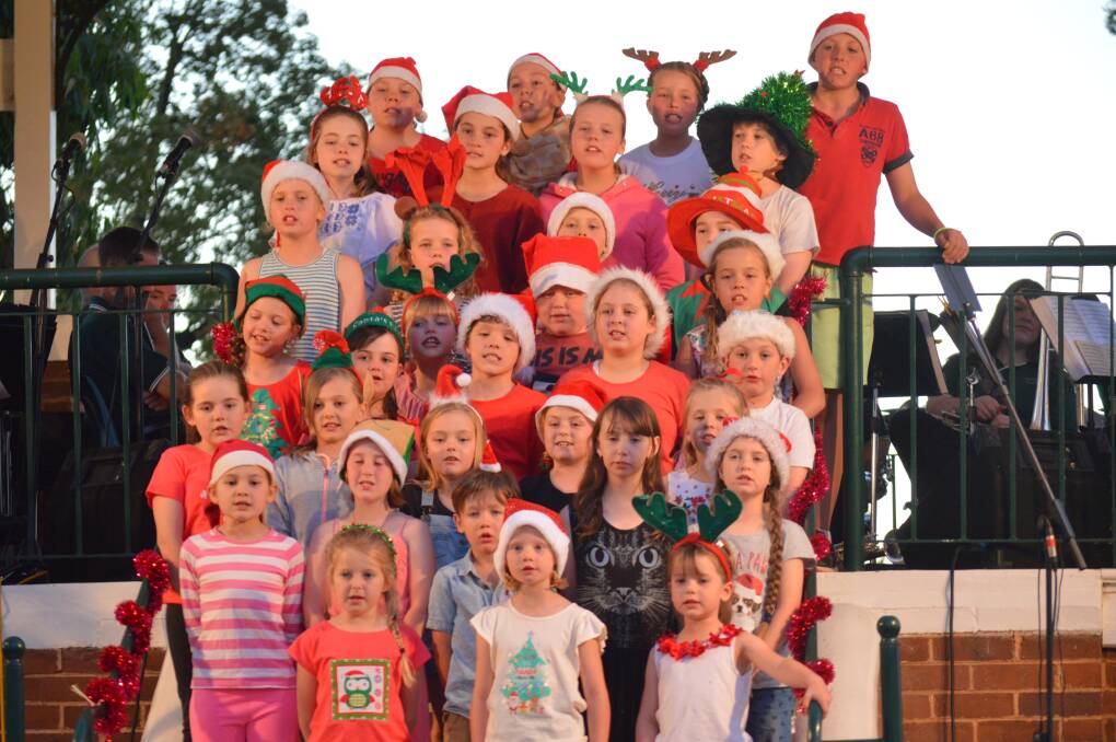 Students from Grenfell Public School during their performance at last year's Christmas Carols in the Park.