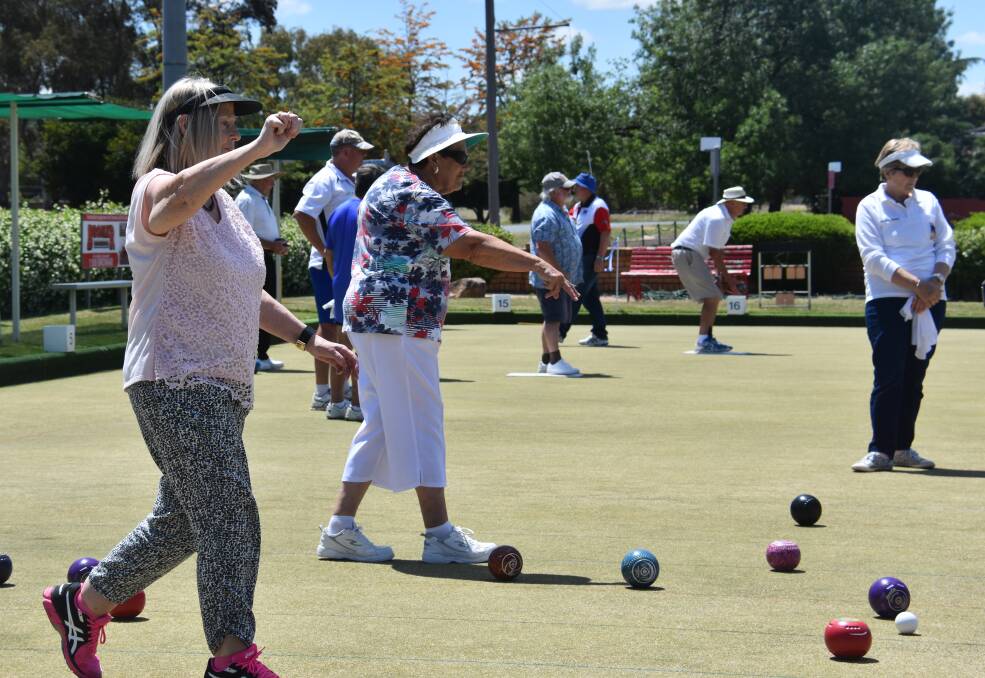 LAWN BOWLS: Grenfell bowlers out on the greens with their visitors during a recent tournament.