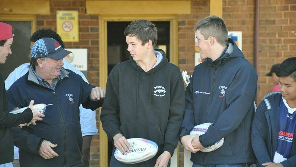 Tom Robinson (R) of Grenfell receives a special award at the Temora Tuskers presentation day. Photo Temora Tuskers.