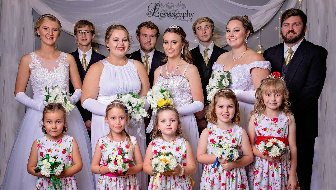 The stunning 2018 Quandialla Debutantes with their partners and flower girls. Photo "Loveography" Young.  