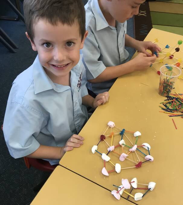 Jack Ryan with his 3D model, Jack discovered that marshmallows are not a great building material. Photo St Josephs Primary School. 