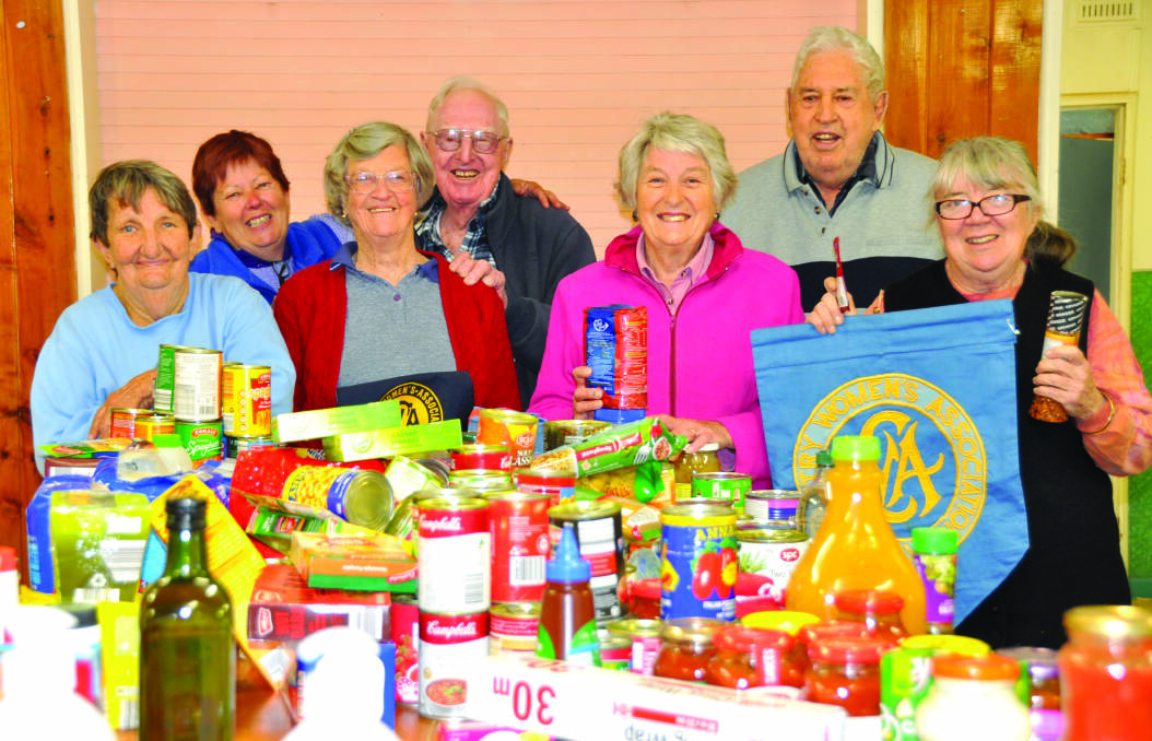 Bourke CWA drought relief volunteers Lilly Flann, Lee Sharpe, Pam and Neville Simpson, Elaine and Ross Pereira of Cowra and Sally Torr. Photo The Western Herald.