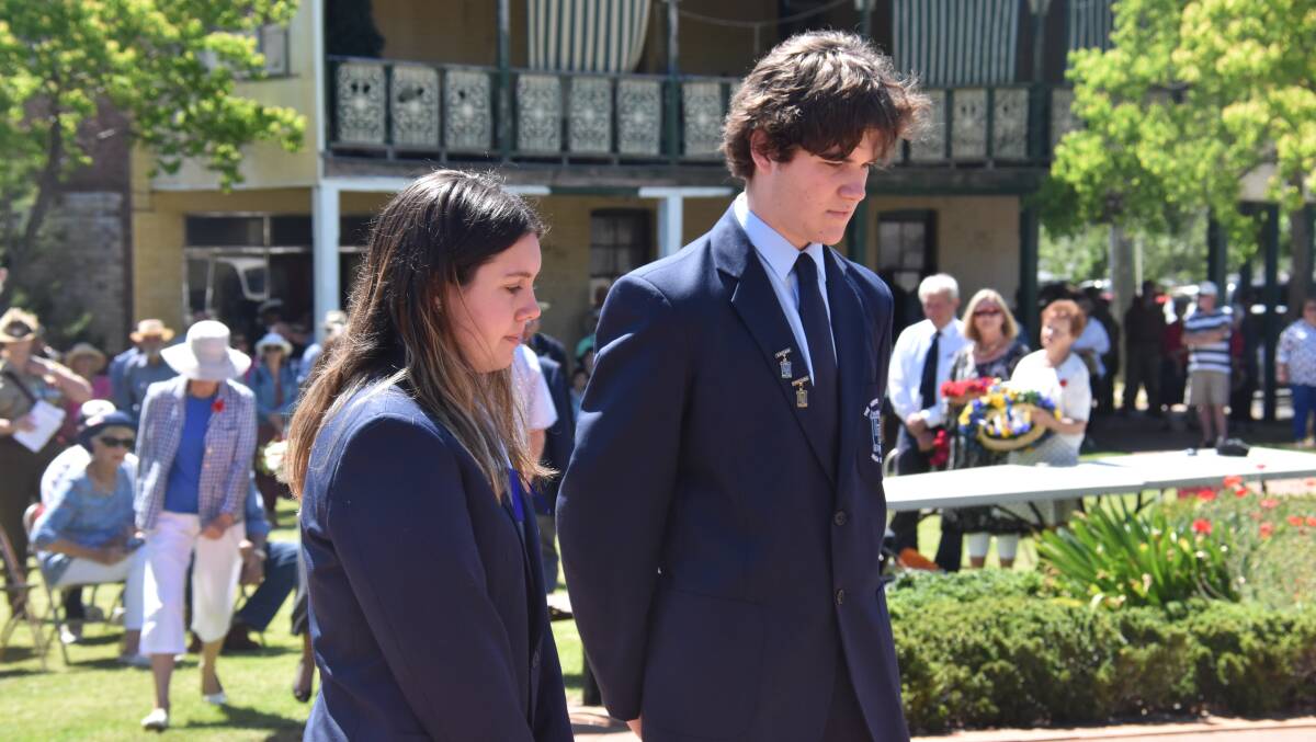 The Henry Lawson High School captains Bridgett Baker and Connor Day laying a wreath.
