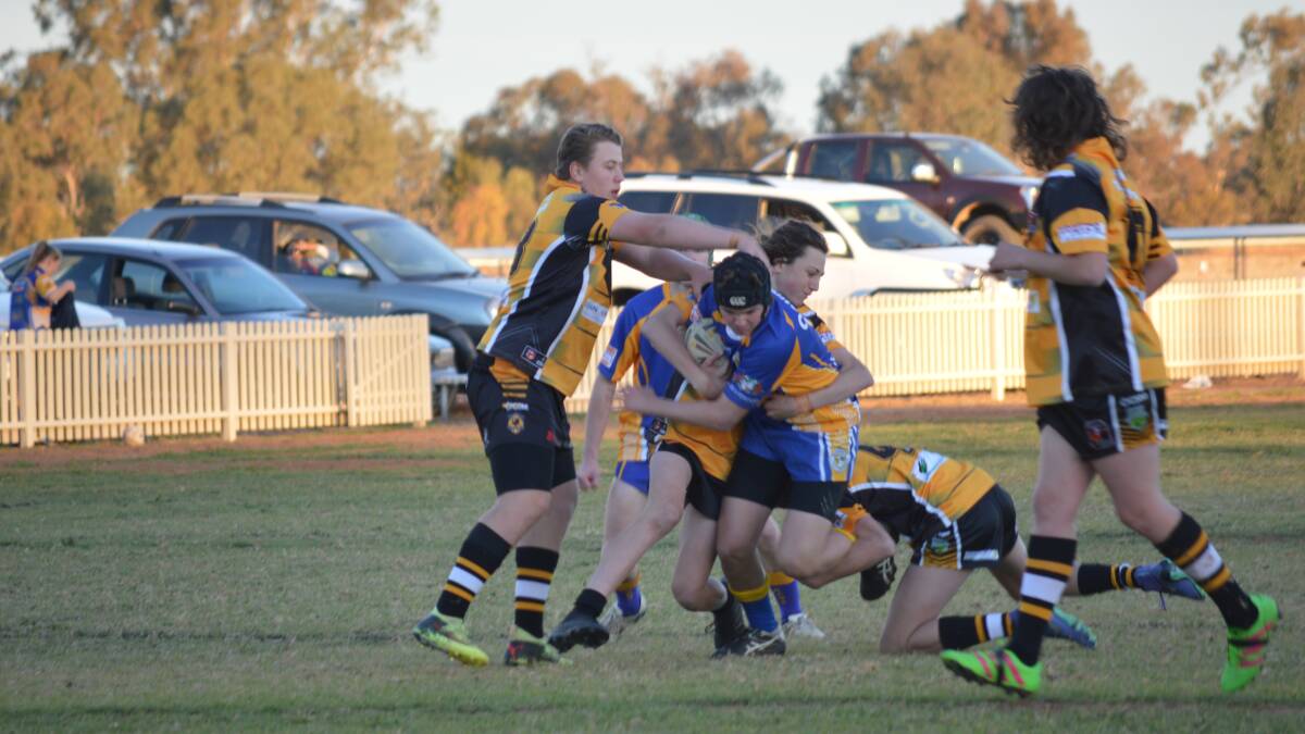 Grenfell U16s Rugby League side take on Condobolin recently during a hard-fought away clash. 