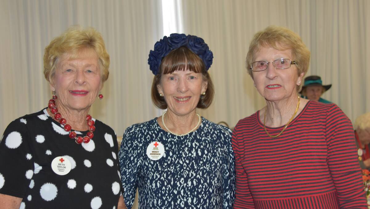 Beth Taylor, Wendy Anderson and Jan Eastaway at the Red Cross Grenfell Branch Melbourne Cup day luncheon. 